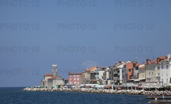 Piran waterfront under blue sky