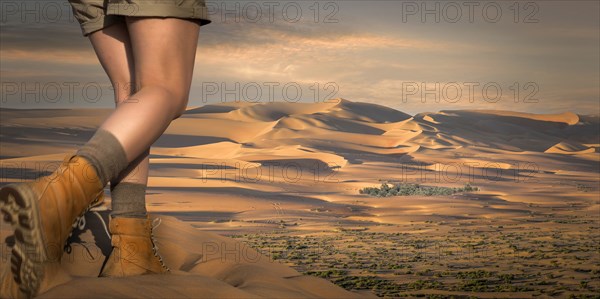 Caucasian woman hiking in desert sand dunes