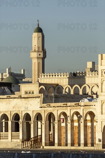 Ornate building and tower under blue sky