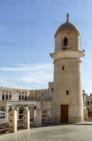 Ornate building and tower under blue sky