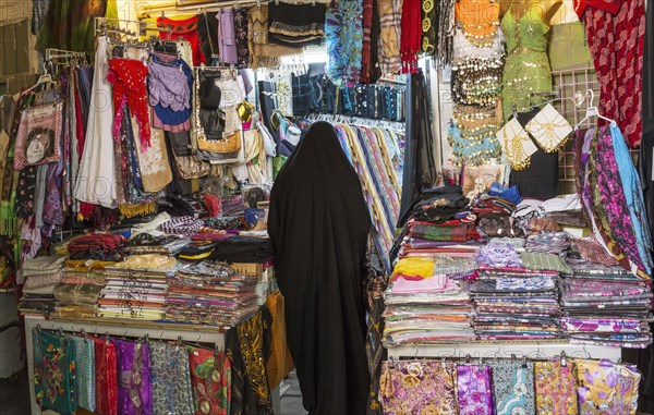Woman shopping in fabric market