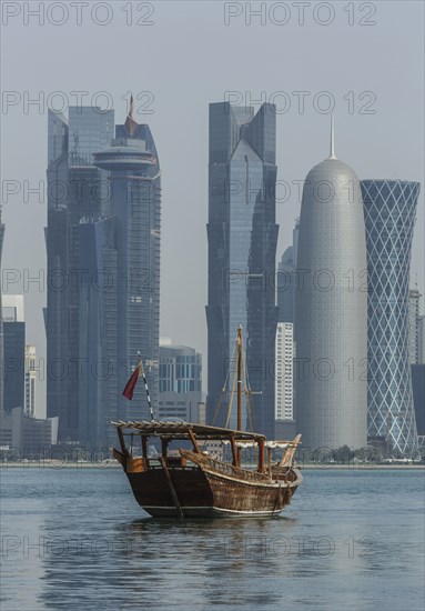 Boat floating near Doha skyline