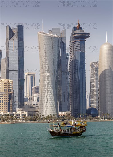 Boat floating near Doha skyline