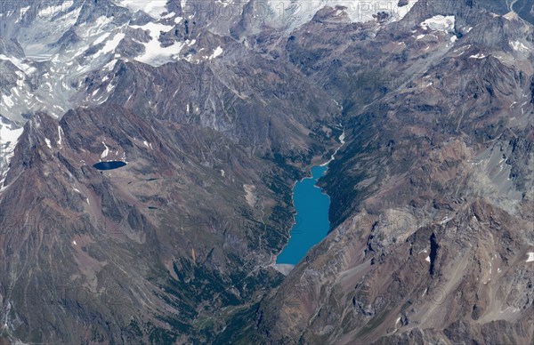 Aerial view of lakes in snowy mountain landscape