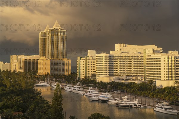 Sunset on boats at urban waterfront