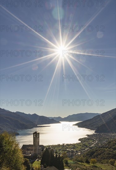 Sun in blue sky over Gravedona