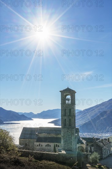 Sun in blue sky over Gravedona