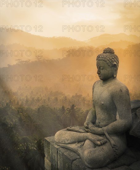 Statue of Buddha at sunset