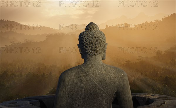 Statue of Buddha at sunset