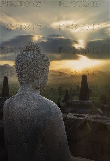 Statue of Buddha at sunset