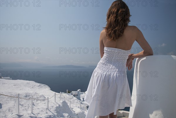 Caucasian woman admiring scenic view of ocean