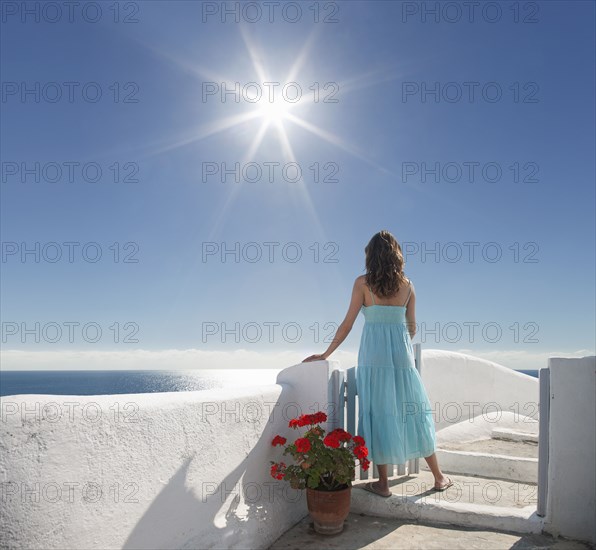 Caucasian woman admiring scenic view of ocean