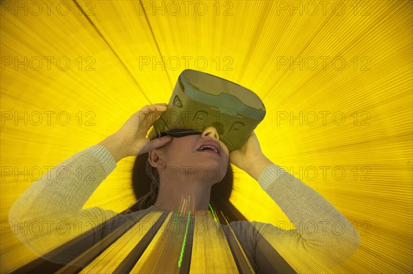 Caucasian woman wearing virtual reality goggles