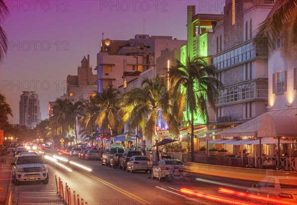 Cars driving in street at night