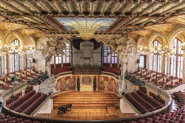 Piano near stage in ornate theater