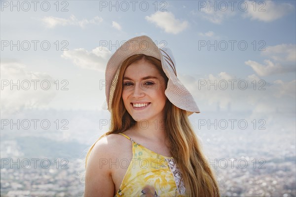 Portrait of smiling Caucasian woman wearing hat