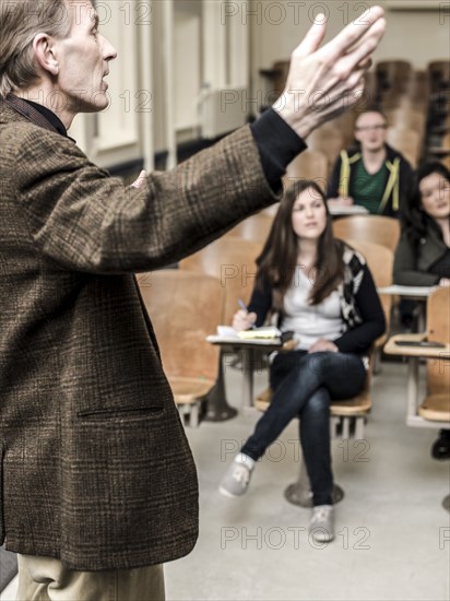 Teacher talking to students in classroom