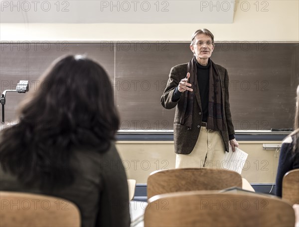 Teacher talking to students in classroom