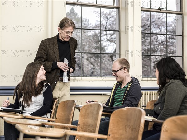 Teacher talking to students in classroom