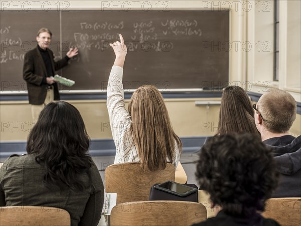 Teacher talking to students in classroom