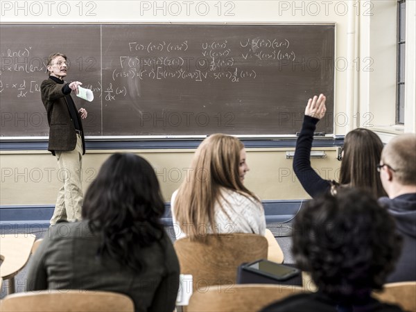 Teacher talking to students in classroom