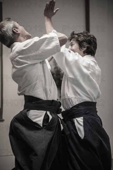 Caucasian people practicing martial arts