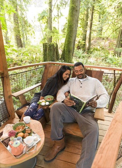 Couple relaxing together on deck