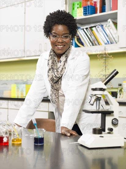 Black teacher smiling in chemistry lab