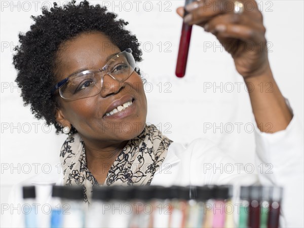 Black scientist examining samples in lab