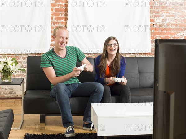 Couple playing video games together