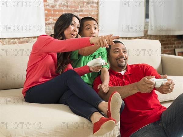 Family playing video games together