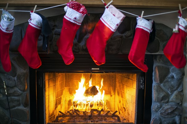 Christmas stockings hanging over fireplace