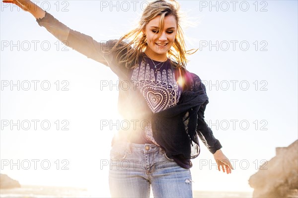 Caucasian girl playing outdoors