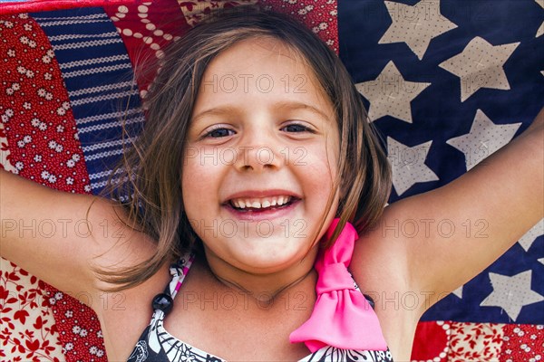 Caucasian girl holding blanket