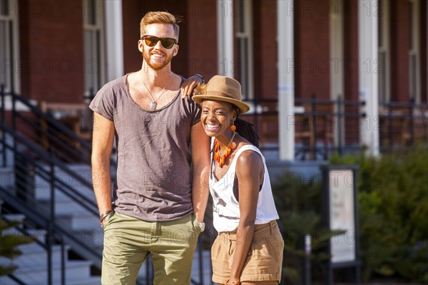 Laughing couple walking outdoors