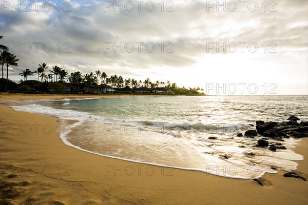 Ocean waves washing up on tropical beach