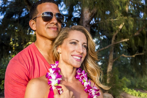 Couple hugging on tropical vacation