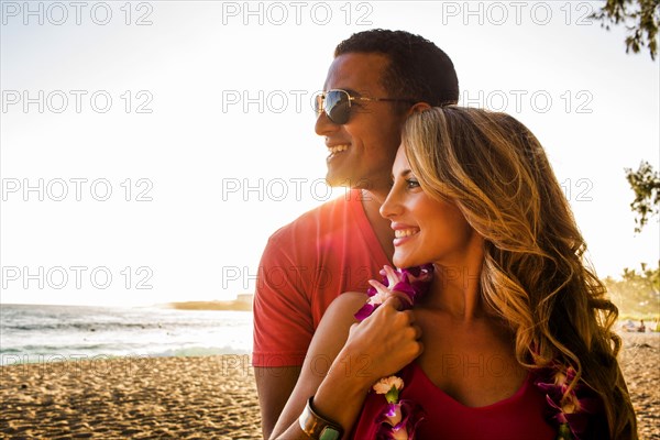 Couple hugging on tropical beach