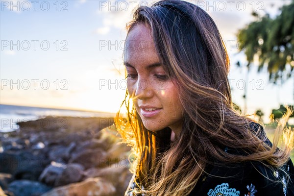 Close up of Caucasian woman on rocky beach