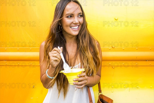 Caucasian woman eating shaved ice