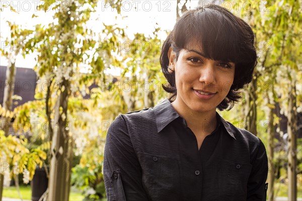 Hispanic woman smiling in park