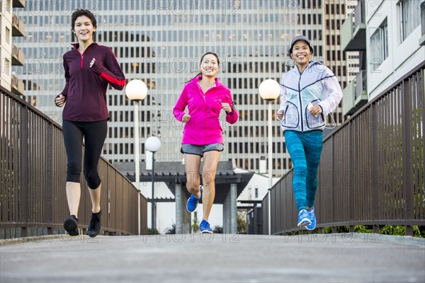 Women running in city