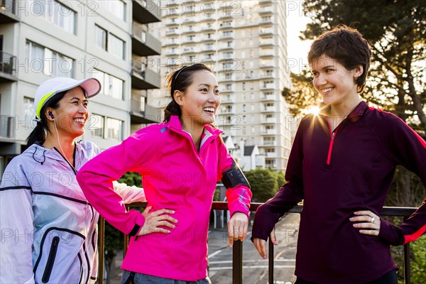 Runners talking in city