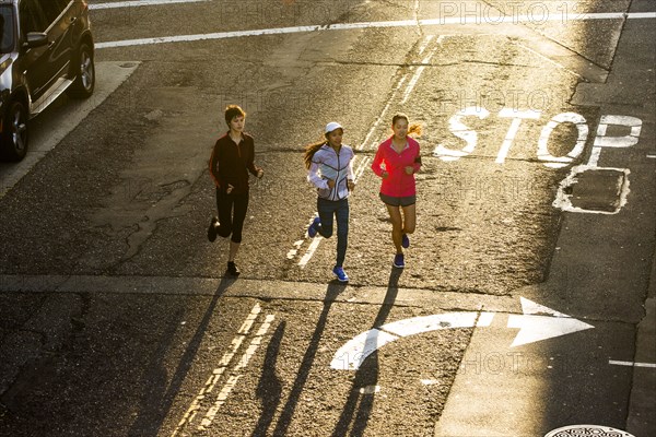 High angle view of women running in street