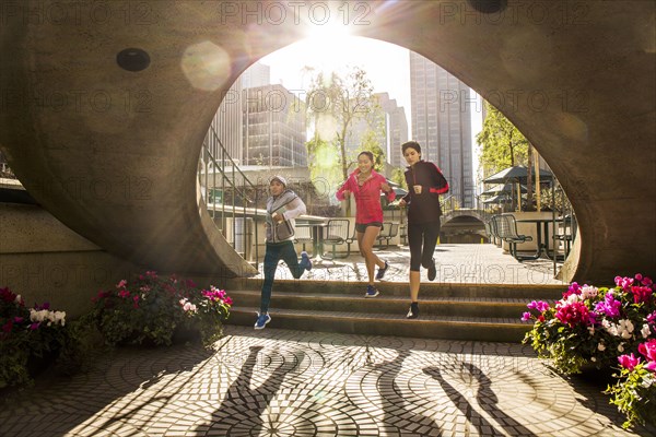 Women running in urban park