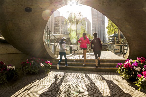 Women running in urban park