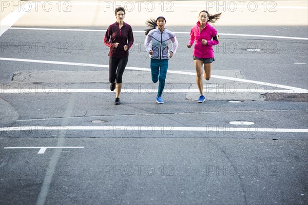 High angle view of women running in city street