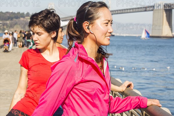 Runner stretching at waterfront