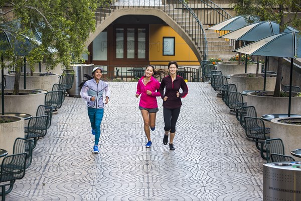 High angle view of women running in urban park