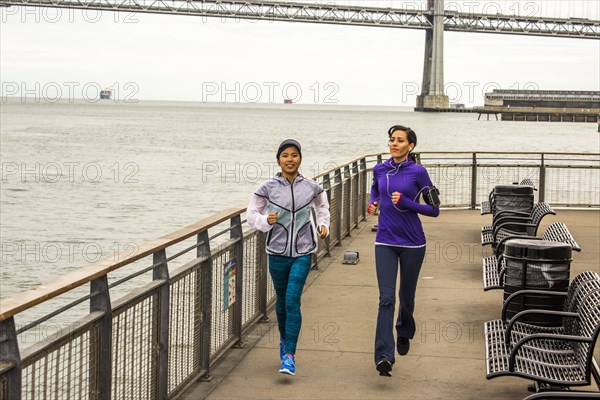 High angle view of women running at waterfront